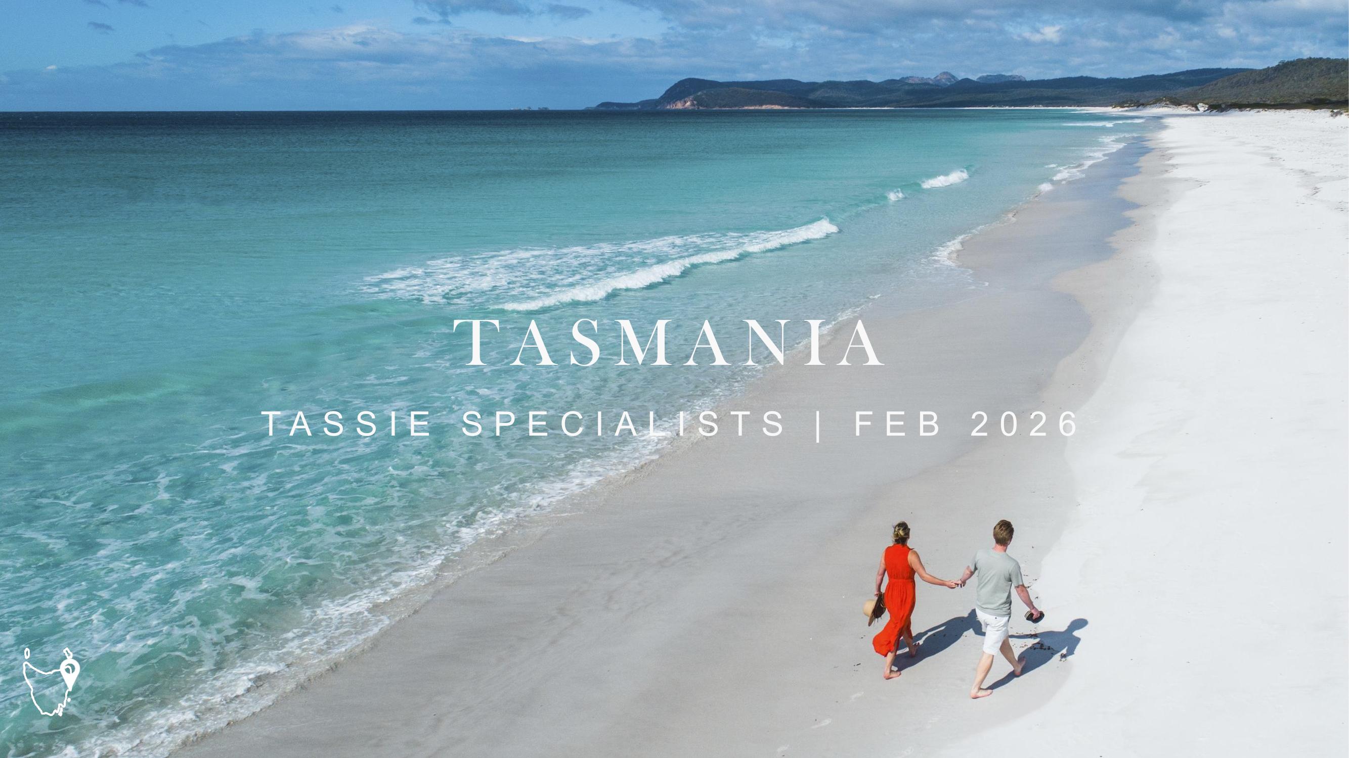 Tassie Specialists webinar title slide, February 2026, over two people walking on a white sand beach