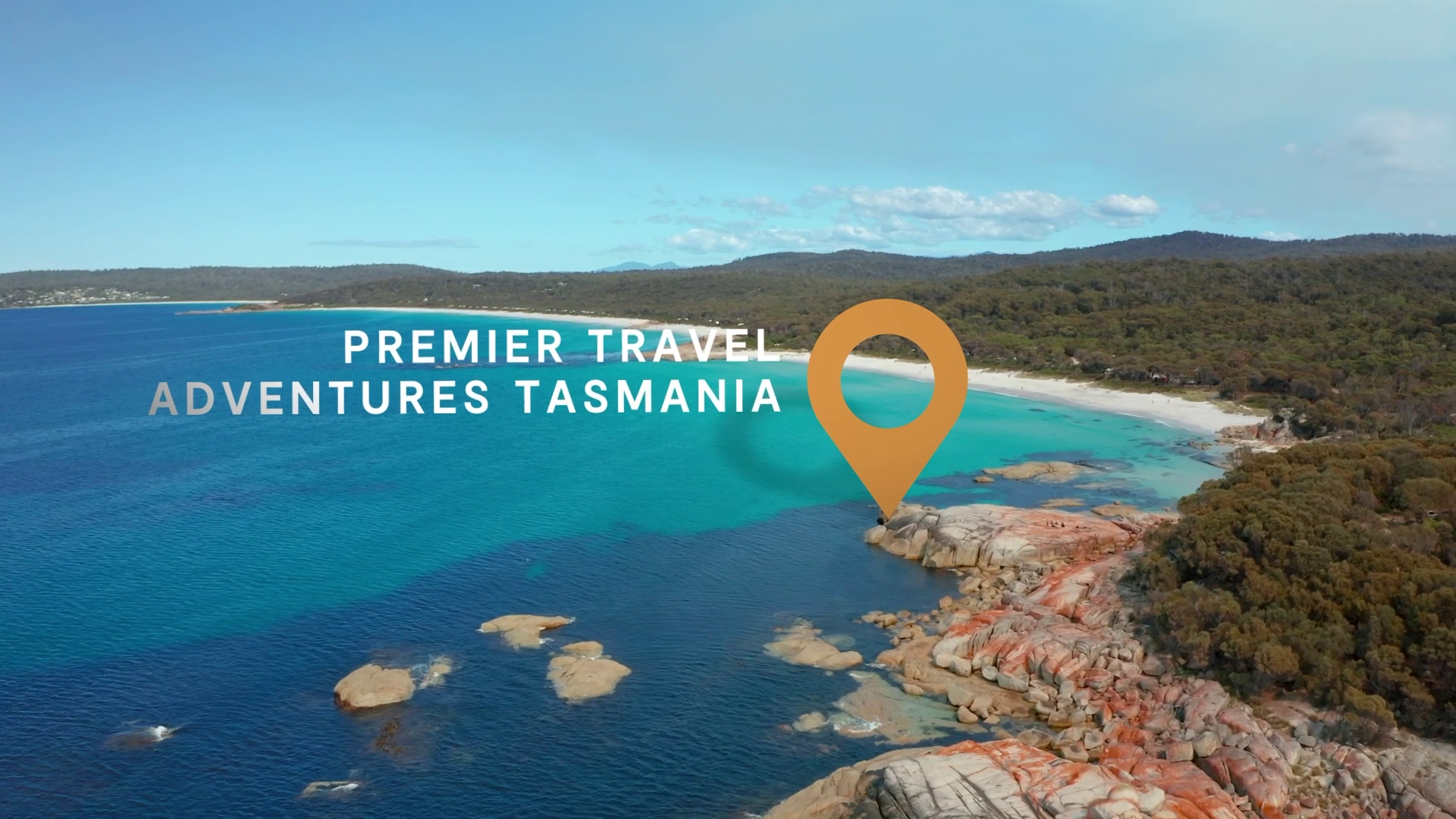 Premier Travel Adventures Tasmania video still with a location pin over an aerial of a rocky turquoise coastline